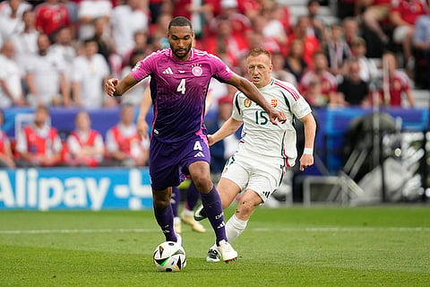 Jonathan Tah controls the ball during match against Hungary